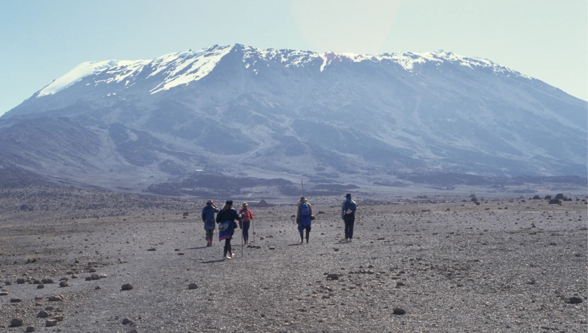 Climbers ascending the upper slopes of Kilimanjaro toward the summit